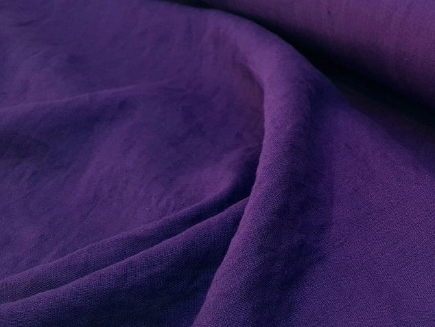 Roll of purple linen fabric
