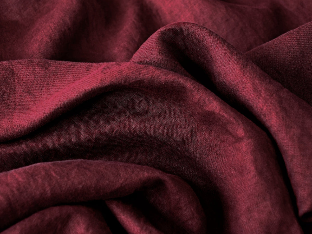 Close-up of dark red fabric with visible texture