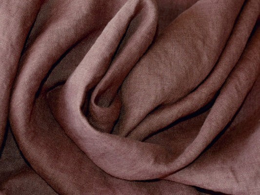 Close-up of brown fabric with folds