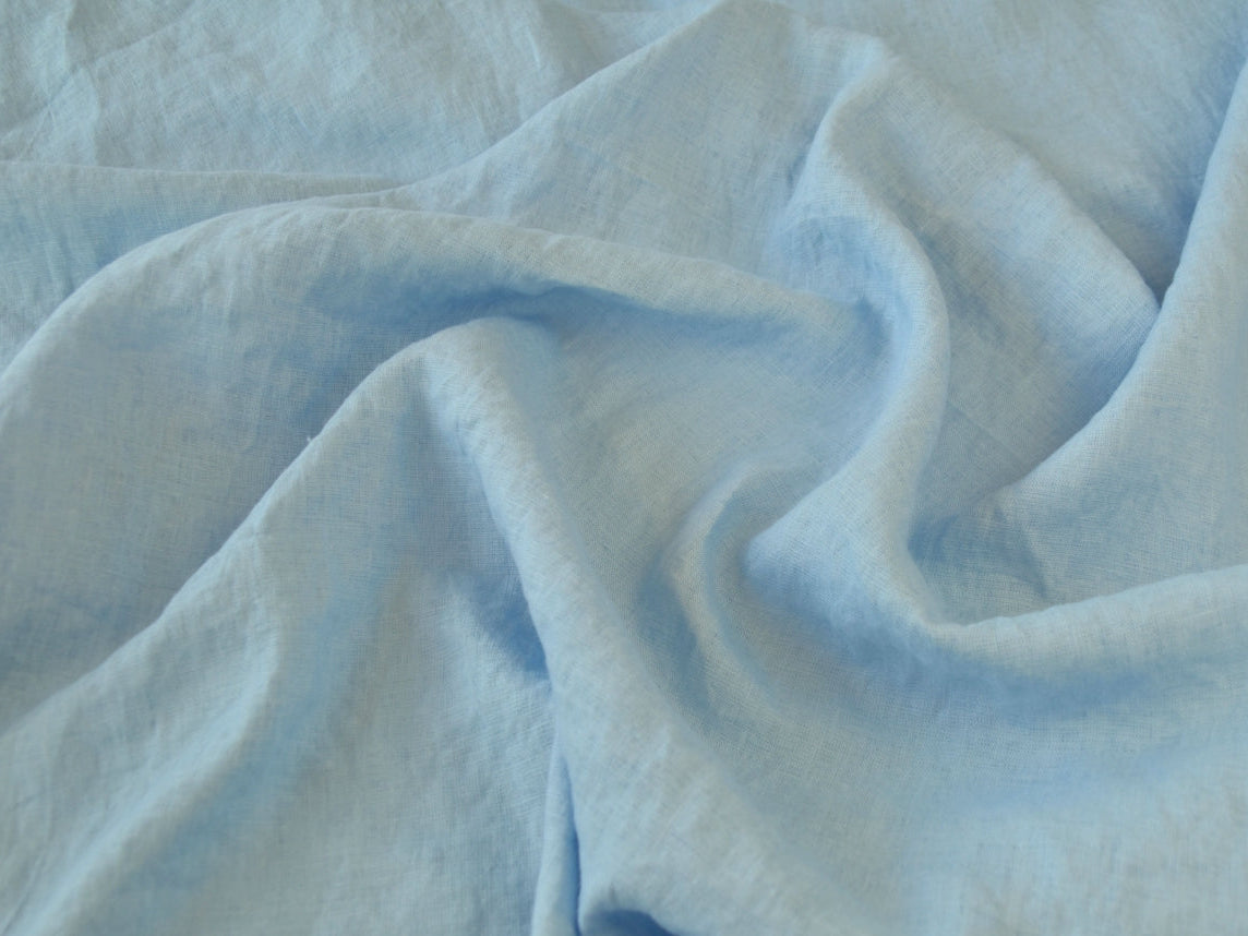 Close-up of light blue fabric with folds
