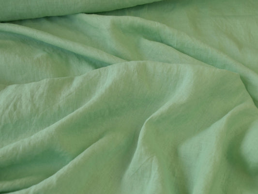 Close-up of green fabric with folds